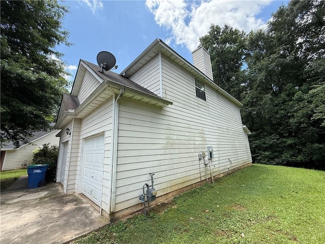 545 Platoro Ct SW, Atlanta, GA 30331 - view of side of property featuring a chimney, a yard, and a garage