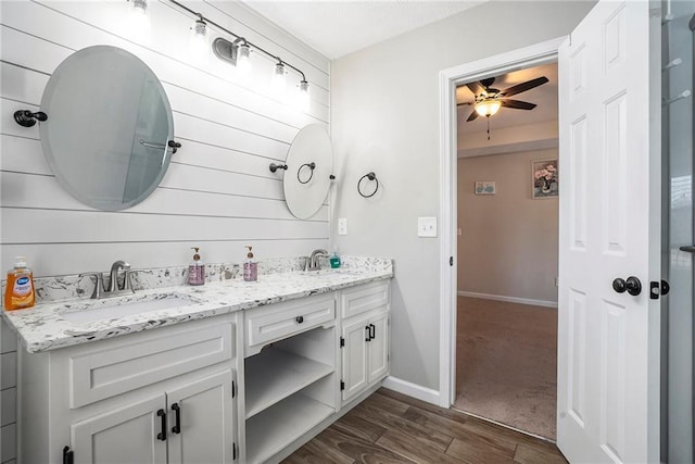 bathroom with ceiling fan and vanity