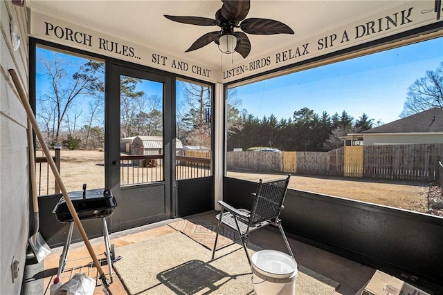 sunroom / solarium with ceiling fan