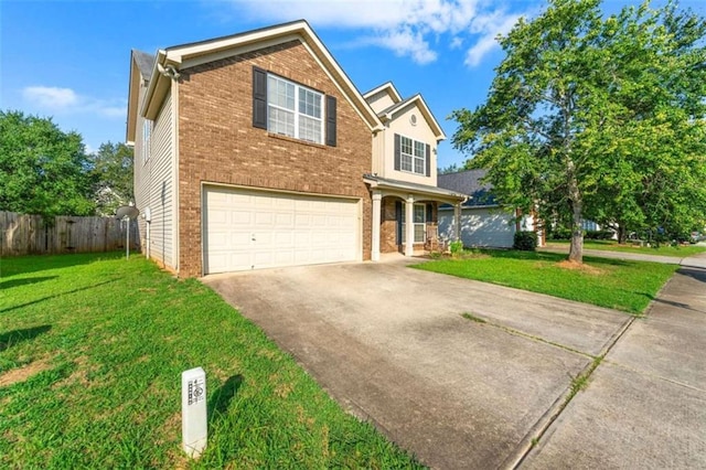 view of front facade with a garage and a front lawn