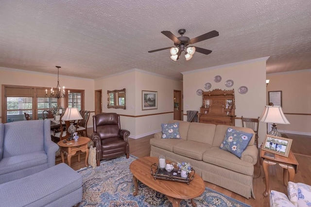 3743 Johnston Rd, Winston, GA 30187 - living area with wood finished floors, a chandelier, a textured ceiling, ceiling fan, and ornamental molding