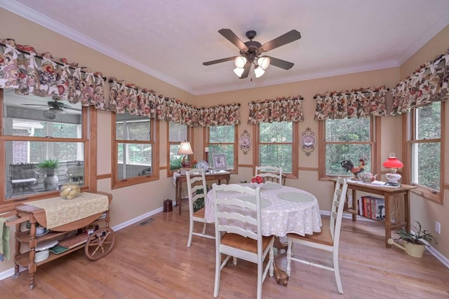 3743 Johnston Rd, Winston, GA 30187 - dining area featuring ceiling fan, light wood-style flooring, and ornamental molding