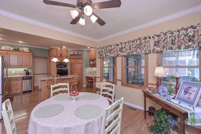 3743 Johnston Rd, Winston, GA 30187 - dining room featuring light wood finished floors, a ceiling fan, ornamental molding, and a textured ceiling