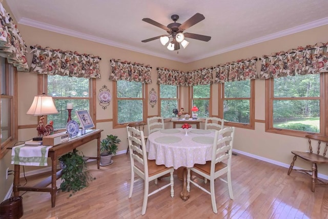 3743 Johnston Rd, Winston, GA 30187 - dining room featuring light wood-style flooring, ceiling fan, and crown molding