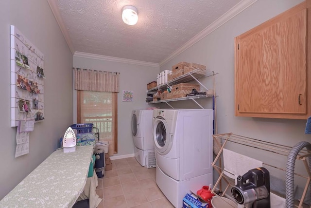 3743 Johnston Rd, Winston, GA 30187 - laundry area featuring washing machine and dryer, light tile patterned floors, ornamental molding, and a textured ceiling