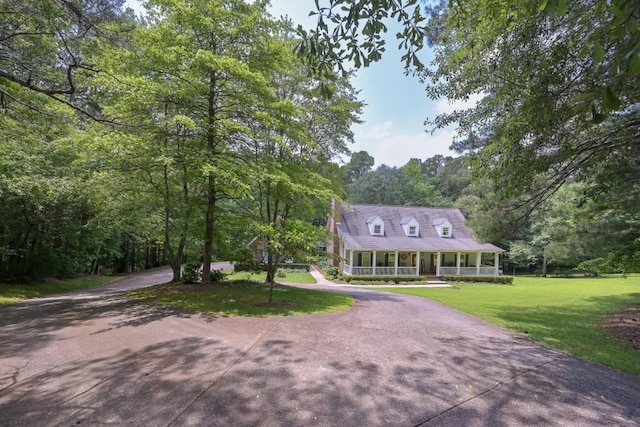 3743 Johnston Rd, Winston, GA 30187 - view of front of house featuring covered porch, a front lawn, asphalt driveway, and a wooded view