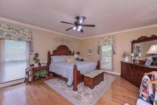 3743 Johnston Rd, Winston, GA 30187 - bedroom featuring multiple windows, light wood-type flooring, crown molding, ceiling fan, and a textured ceiling