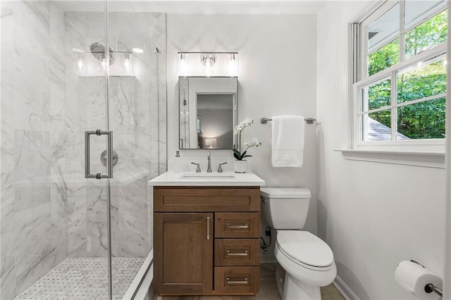 893 Vistavia Cir, Decatur, GA 30033 - full bath featuring a marble finish shower, toilet, vanity, and baseboards