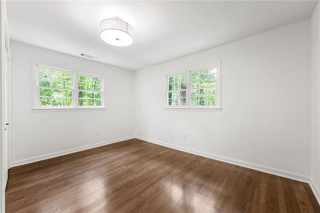 893 Vistavia Cir, Decatur, GA 30033 - unfurnished room with healthy amount of natural light, dark wood finished floors, and baseboards