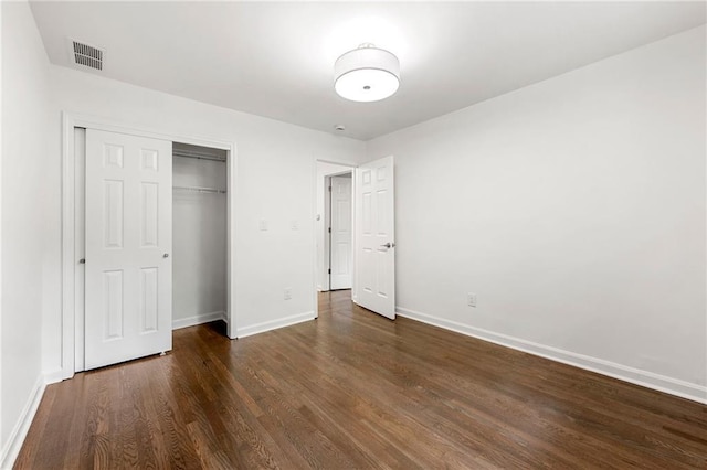 893 Vistavia Cir, Decatur, GA 30033 - unfurnished bedroom featuring baseboards, wood finished floors, and a closet