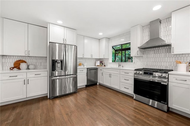 893 Vistavia Cir, Decatur, GA 30033 - kitchen featuring appliances with stainless steel finishes, wall chimney range hood, light countertops, a sink, and tasteful backsplash