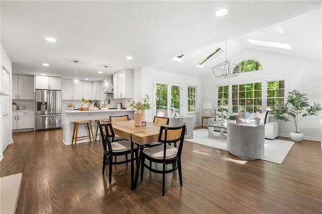893 Vistavia Cir, Decatur, GA 30033 - dining room featuring a skylight, healthy amount of natural light, recessed lighting, dark wood finished floors, and vaulted ceiling