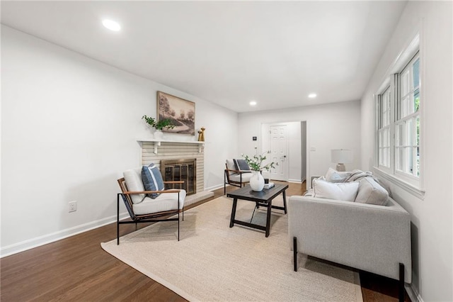 893 Vistavia Cir, Decatur, GA 30033 - living room featuring wood finished floors, a brick fireplace, recessed lighting, and baseboards