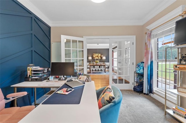 carpeted home office featuring an inviting chandelier and crown molding