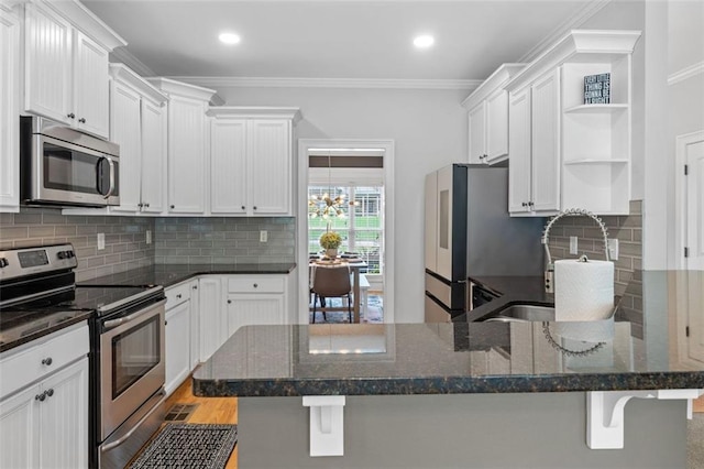 kitchen with open shelves, a sink, appliances with stainless steel finishes, white cabinets, and crown molding