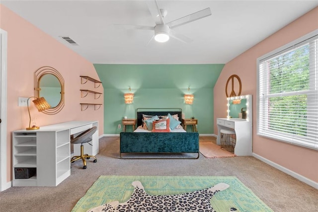 bedroom with visible vents, carpet flooring, and vaulted ceiling