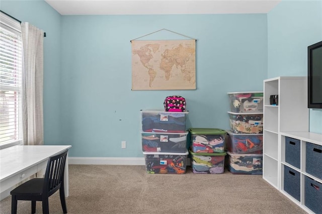 rec room with carpet and baseboards