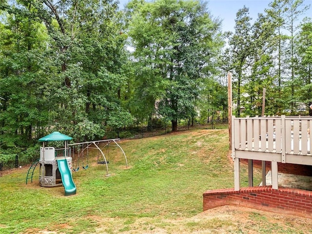 view of yard with a playground and fence