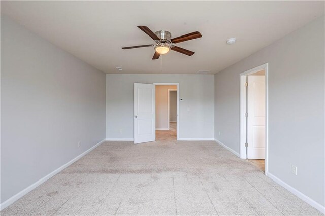 1003 Eldon Ln, Fairburn, GA 30213 - unfurnished room featuring a ceiling fan, light carpet, and baseboards
