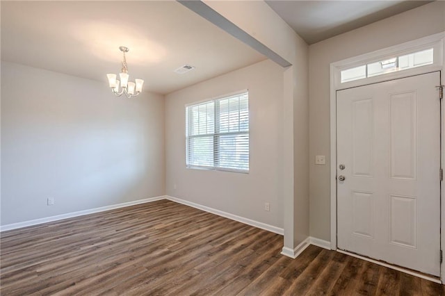 1003 Eldon Ln, Fairburn, GA 30213 - entryway with an inviting chandelier, visible vents, dark wood-style flooring, and baseboards