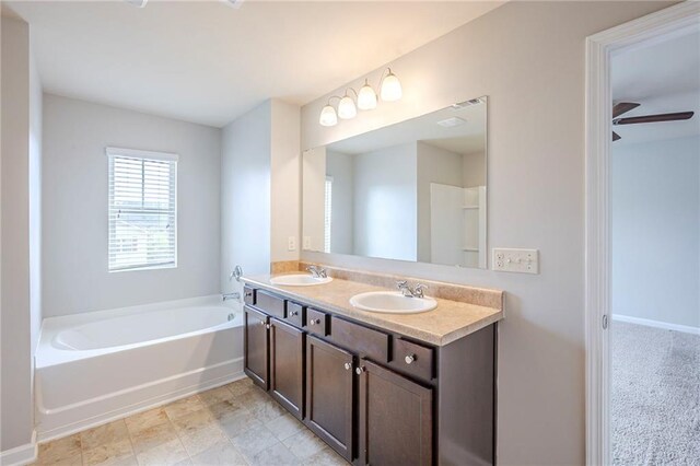 1003 Eldon Ln, Fairburn, GA 30213 - full bathroom with double vanity, a garden tub, and a sink