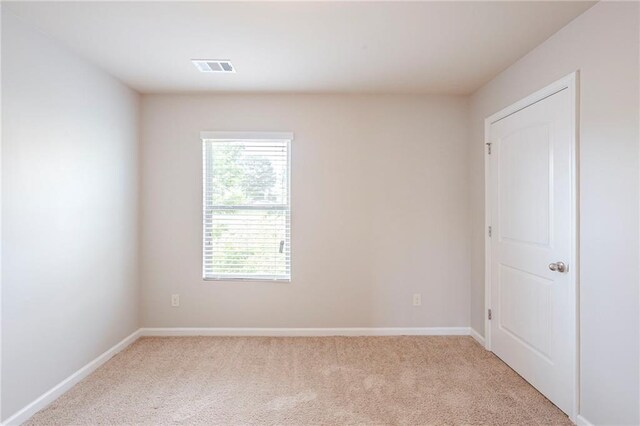1003 Eldon Ln, Fairburn, GA 30213 - unfurnished room featuring baseboards, visible vents, and light colored carpet