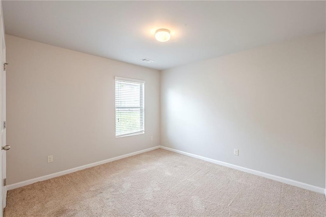 1003 Eldon Ln, Fairburn, GA 30213 - empty room featuring baseboards, light carpet, and visible vents