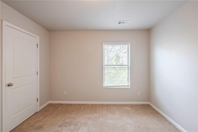 1003 Eldon Ln, Fairburn, GA 30213 - unfurnished room featuring baseboards, visible vents, and light colored carpet