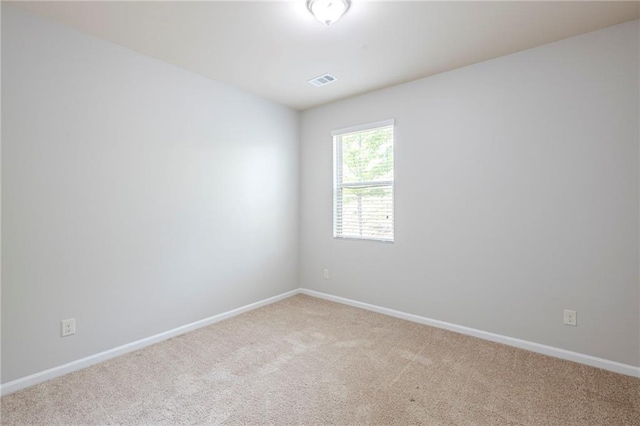 1003 Eldon Ln, Fairburn, GA 30213 - spare room featuring light colored carpet, baseboards, and visible vents