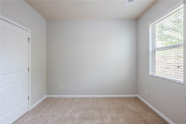 1003 Eldon Ln, Fairburn, GA 30213 - empty room featuring baseboards, light carpet, and visible vents