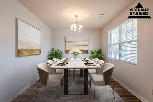1003 Eldon Ln, Fairburn, GA 30213 - dining room featuring visible vents, wood finished floors, baseboards, and a notable chandelier