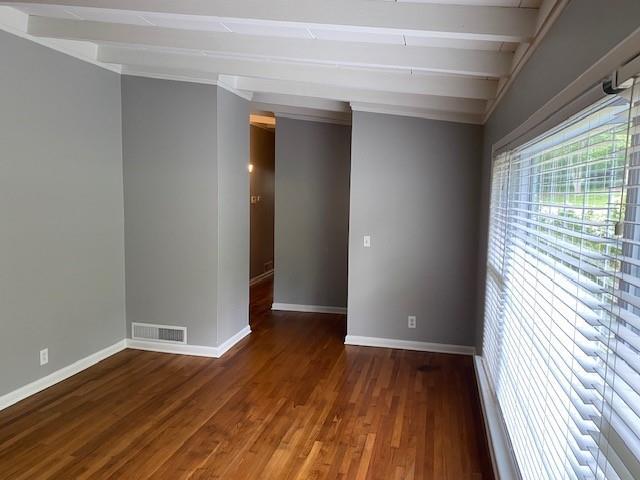 1177 Baker Ln, Marietta, GA 30062 - unfurnished room featuring baseboards, wood finished floors, and beamed ceiling