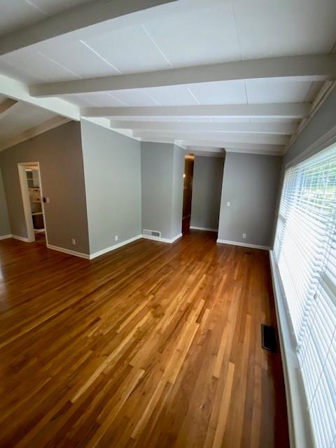 1177 Baker Ln, Marietta, GA 30062 - unfurnished room with baseboards, beamed ceiling, and wood finished floors
