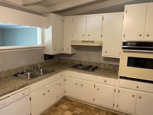 1177 Baker Ln, Marietta, GA 30062 - kitchen with white appliances, under cabinet range hood, a sink, white cabinets, and beam ceiling