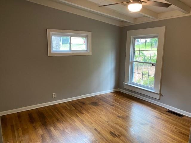 1177 Baker Ln, Marietta, GA 30062 - unfurnished room featuring ceiling fan, beamed ceiling, wood finished floors, and baseboards