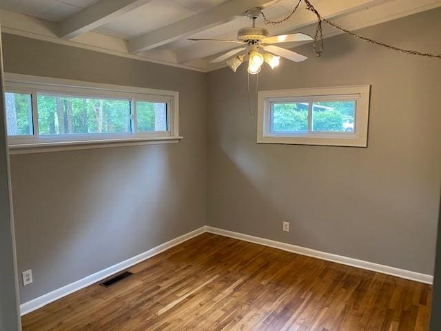 1177 Baker Ln, Marietta, GA 30062 - spare room with plenty of natural light, baseboards, beamed ceiling, dark wood-style flooring, and a ceiling fan