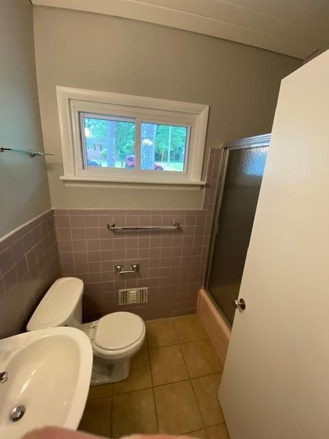 1177 Baker Ln, Marietta, GA 30062 - full bathroom with tile walls, tile patterned flooring, an enclosed shower, toilet, and a sink