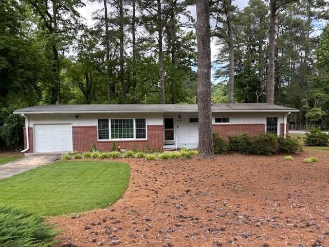 1177 Baker Ln, Marietta, GA 30062 - ranch-style house featuring brick siding, a garage, concrete driveway, view of scattered trees, and a front lawn