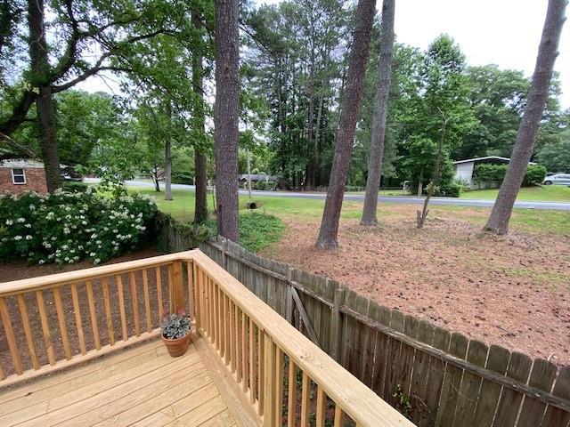 1177 Baker Ln, Marietta, GA 30062 - deck featuring view of wooded area
