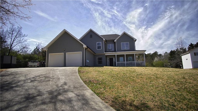 view of front of house featuring a porch, a garage, a front lawn, and concrete driveway