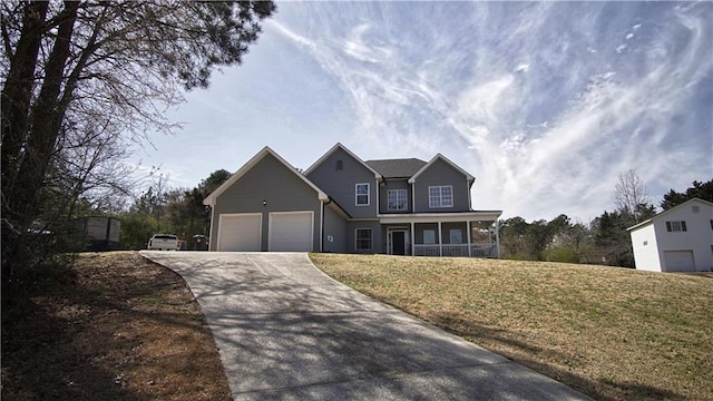 traditional home with driveway, a front lawn, an attached garage, and a sunroom