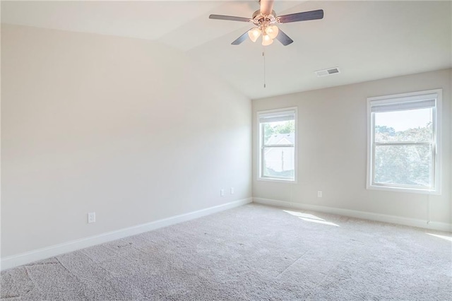 235 Orchard Dr, Covington, GA 30014 - empty room with light carpet, vaulted ceiling, and a ceiling fan