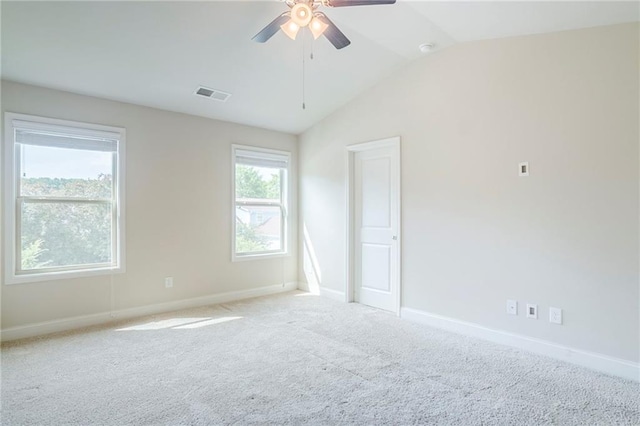 235 Orchard Dr, Covington, GA 30014 - empty room with vaulted ceiling, a ceiling fan, and light colored carpet