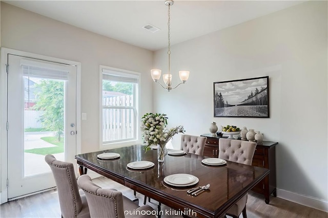 235 Orchard Dr, Covington, GA 30014 - dining area with wood finished floors and a chandelier