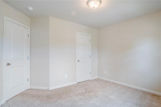 235 Orchard Dr, Covington, GA 30014 - unfurnished bedroom featuring carpet floors and baseboards