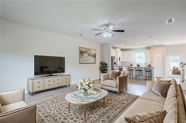 235 Orchard Dr, Covington, GA 30014 - living room featuring light wood-style floors, ceiling fan, and recessed lighting