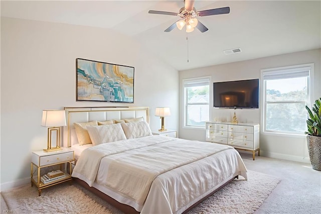 235 Orchard Dr, Covington, GA 30014 - bedroom with carpet floors, lofted ceiling, and a ceiling fan