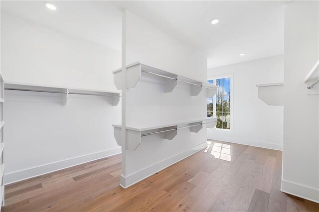 walk in closet featuring hardwood / wood-style flooring