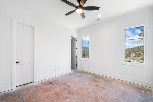 unfurnished bedroom with baseboards, visible vents, ceiling fan, and ornamental molding