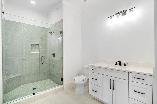 bathroom featuring a shower stall, tile patterned floors, toilet, and vanity